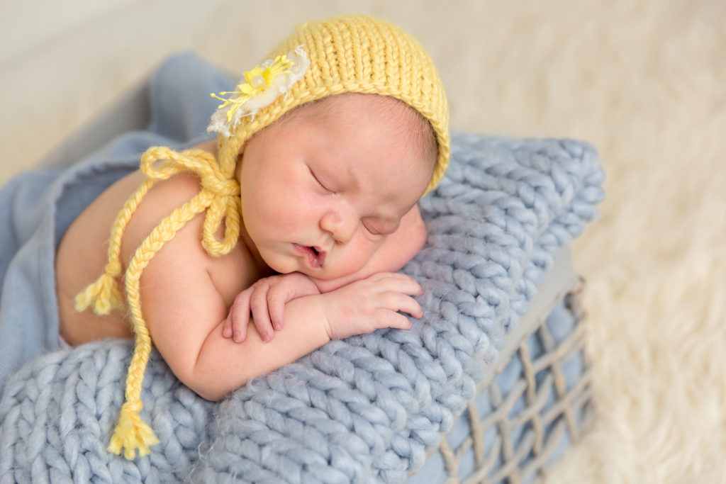 baby asleep in basket