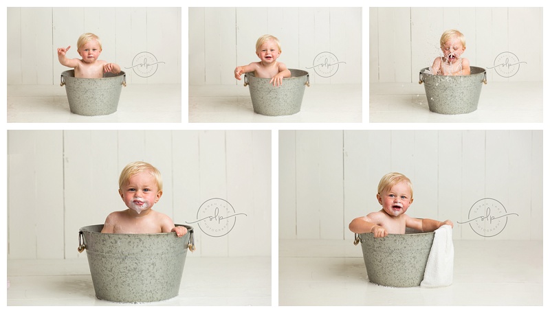 1 year old baby in a bubble bath bucket