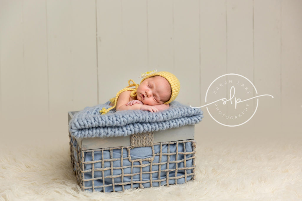 baby in yellow bonnet
