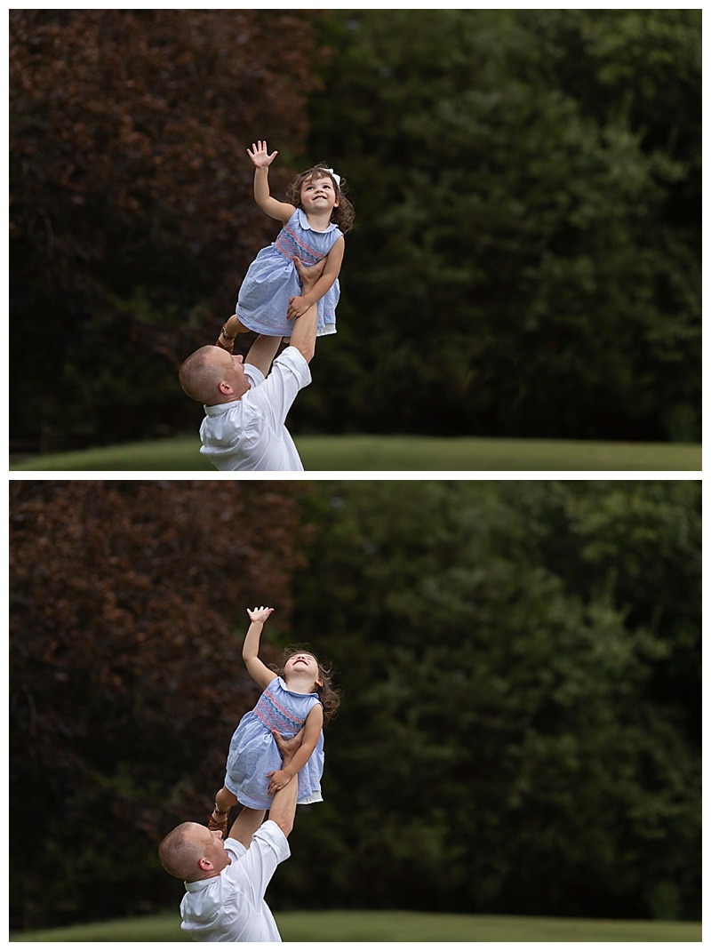 daddy holding daughter in the air