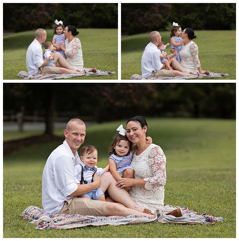 family sitting on blanket