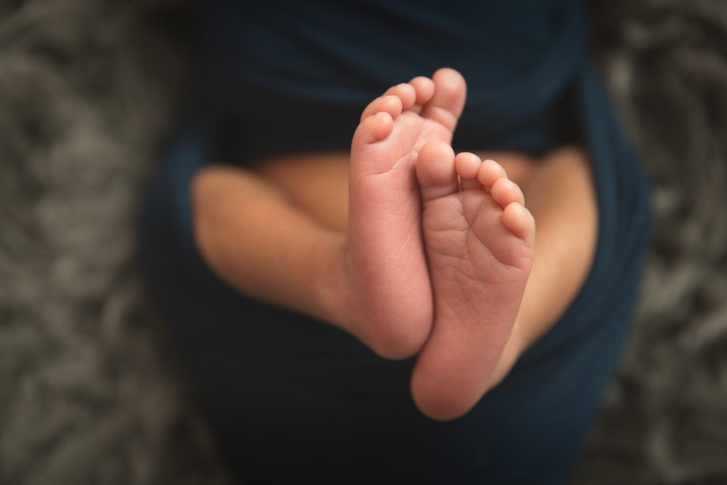 close up of tiny newborn feet