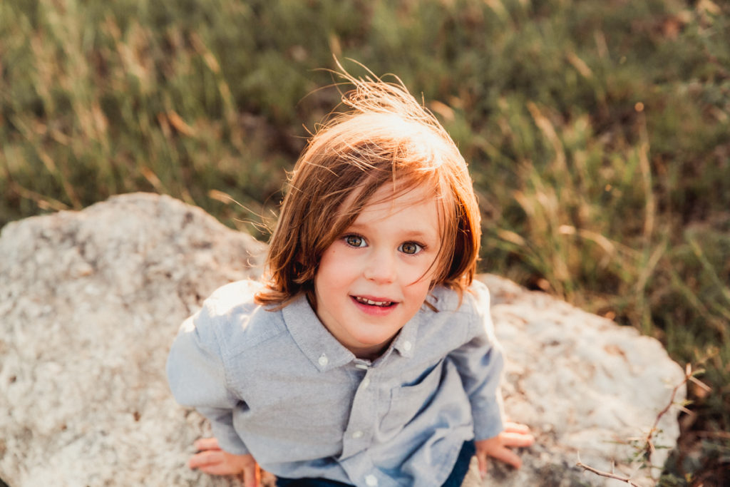 a little boy with whispy hair smiling
