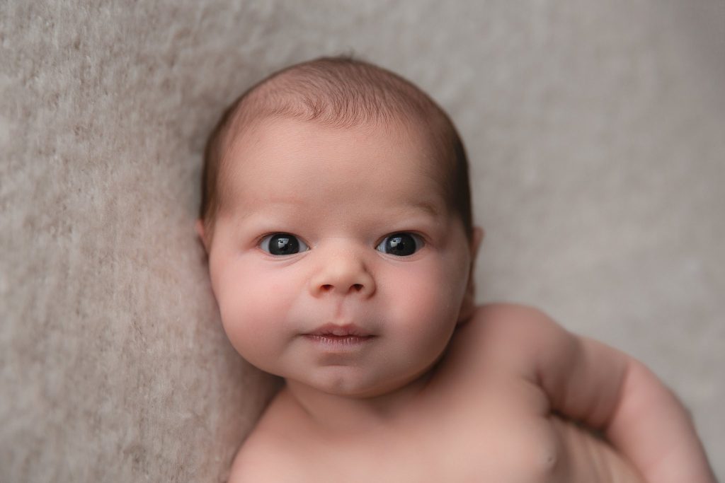 neautiful baby lookin into the camera